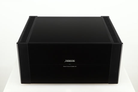 Top view of a used Meridian 557 Power Amplifier in a black finish
