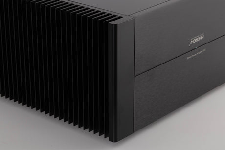 Front left corner view of a used Meridian 557 Stereo Power Amplifier