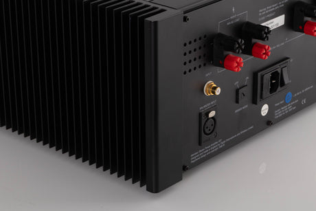 Rear left corner view of a used Meridian 557 Stereo Power Amplifier