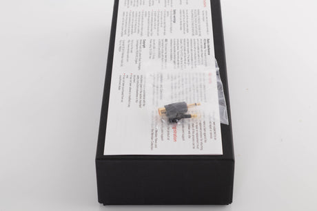 Box for a used Meridian Director Digital Analogue Converter in a Black finish showing Manual and Adaptors