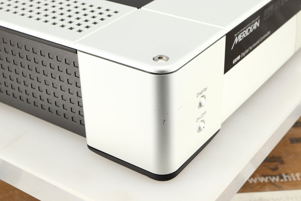 Front left corner of a used Meridian G61R Controller in a silver finish