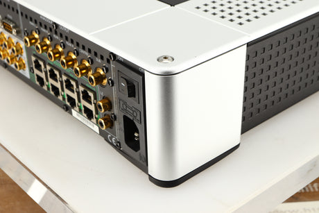 Rear left corner of a used Meridian G61R Controller in a silver finish