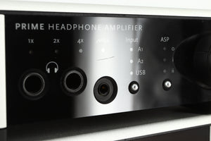 Close up view of a used Meridian Prime Headphone Amplifier showing a scratch under the MQA