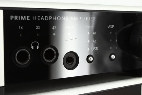 Close up view of a used Meridian Prime Headphone Amplifier showing a scratch under the MQA