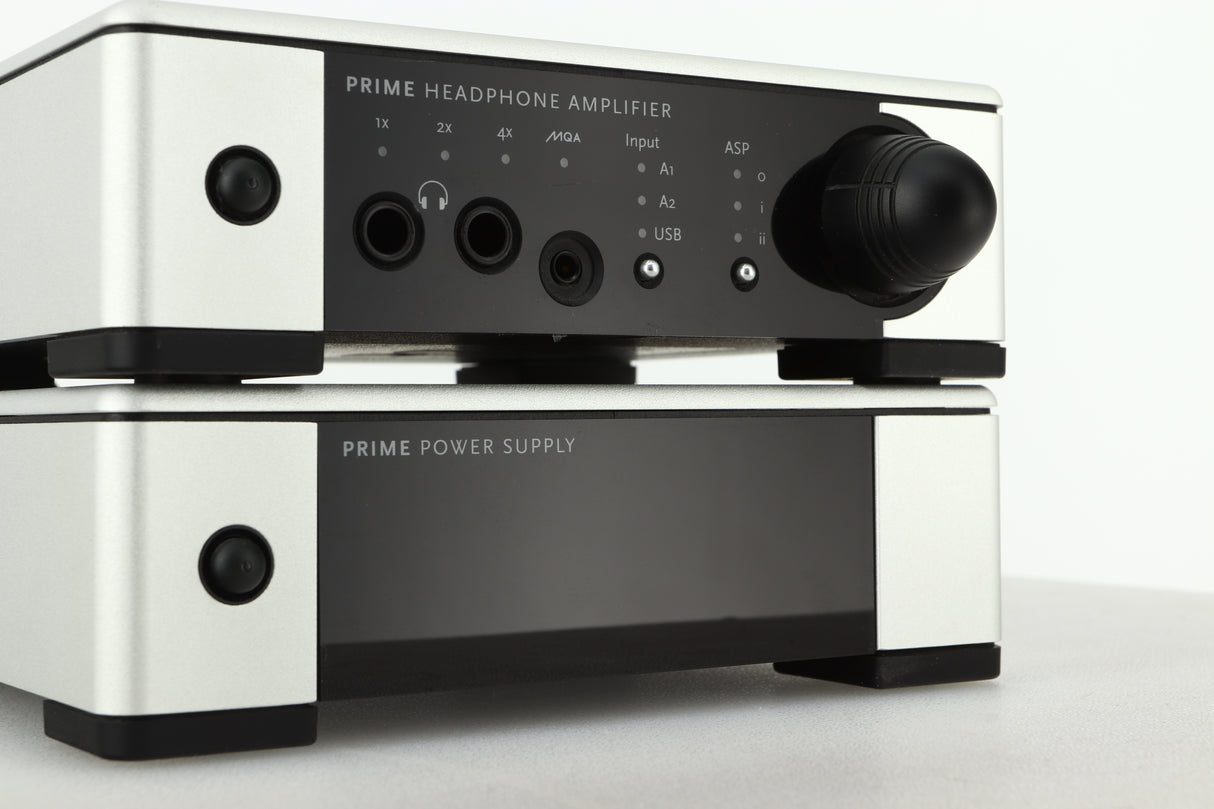 Close up view of a used Meridian Prime Headphone Amplifier and Power Supply in silver finish showing the displays
