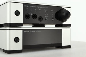 Close up view of a used Meridian Prime Headphone Amplifier and Power Supply in silver finish showing the displays
