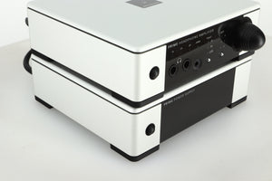 Front left view of a used Meridian Prime Headphone Amplifier and Power Supply in silver finish