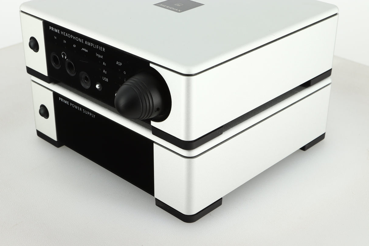 Front right view of a used Meridian Prime Headphone Amplifier and Power Supply in silver finish