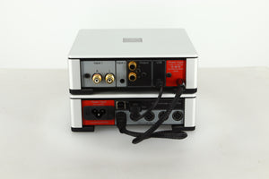 Rear view of a used Meridian Prime Headphone Amplifier and Power Supply in silver finish showing RCA inputs and outputs, mains input, USB input and power connections