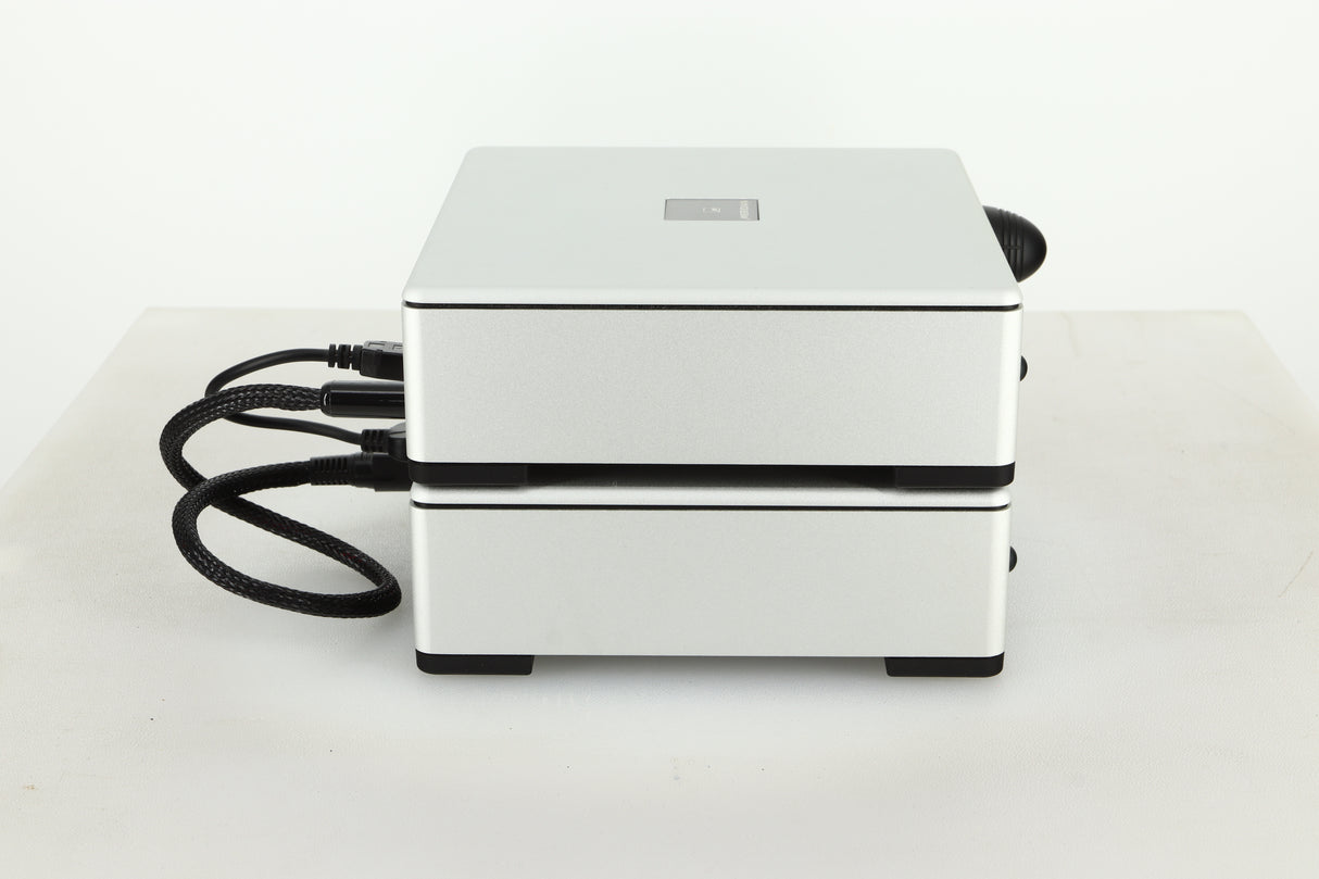 Side view of a used Meridian Prime Headphone Amplifier and Power Supply in silver finish
