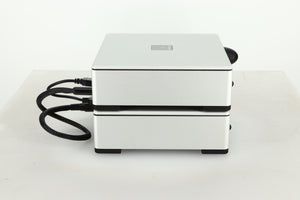 Side view of a used Meridian Prime Headphone Amplifier and Power Supply in silver finish