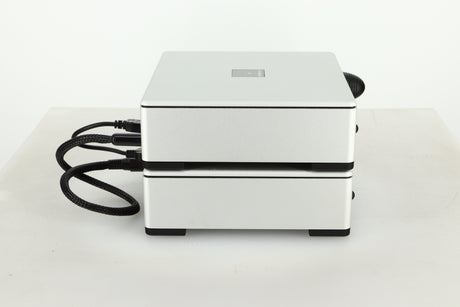 Side view of a used Meridian Prime Headphone Amplifier and Power Supply in silver finish