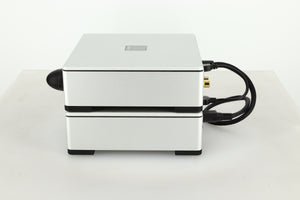 Side view of a used Meridian Prime Headphone Amplifier and Power Supply in silver finish