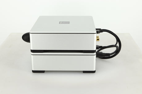 Side view of a used Meridian Prime Headphone Amplifier and Power Supply in silver finish