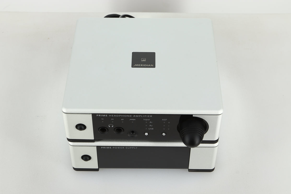 Top view of a used Meridian Prime Headphone Amplifier and Power Supply in silver finish