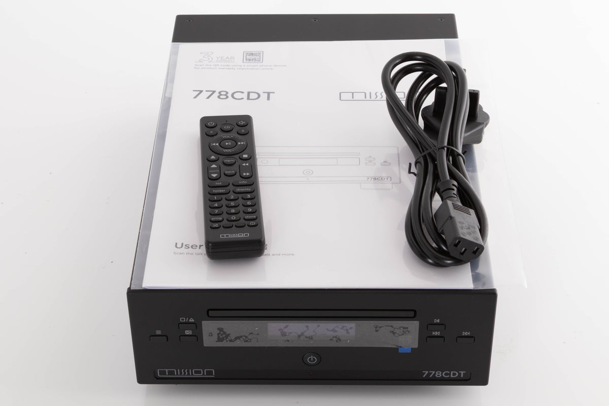 Top of a used Mission 778CDT CD Transport in a Black finish showing Manual, Remote, Batteries and Mains Cable