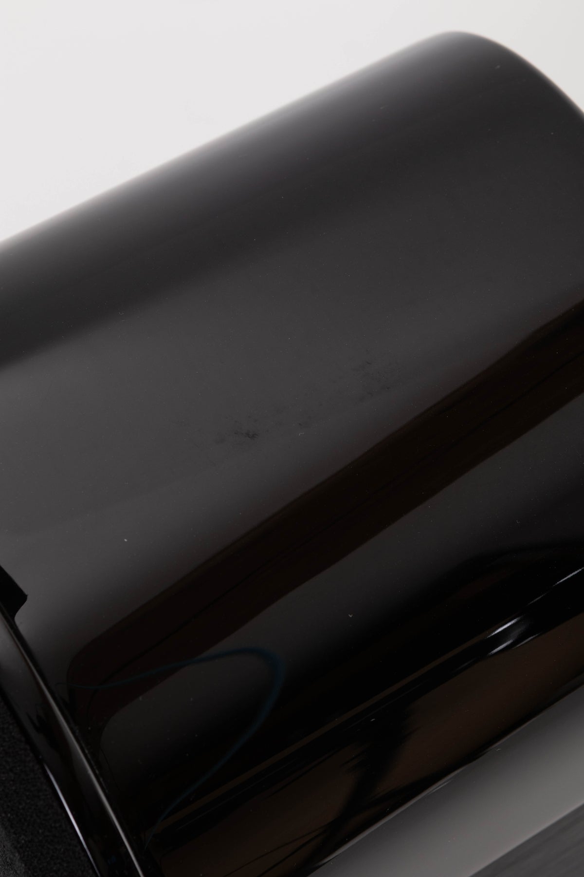 Close up view of a used Monitor Audio APEX 10 Standmount Speaker in Black showing a mark