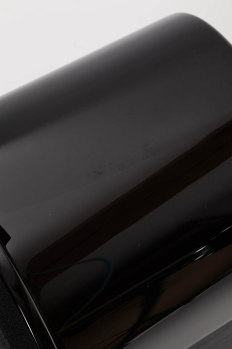 Close up view of a used Monitor Audio APEX 10 Standmount Speaker in Black showing a mark