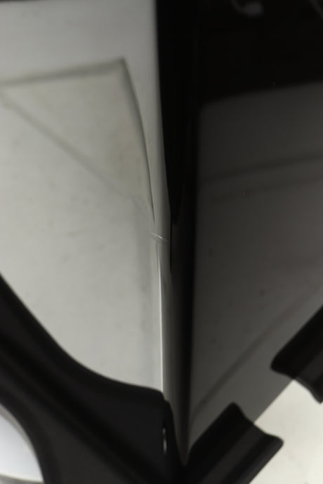 Close up of a used Monitor Audio Gold 200 4G Floorstanding Speaker in a gloss black finish showing small blemish on front left edge