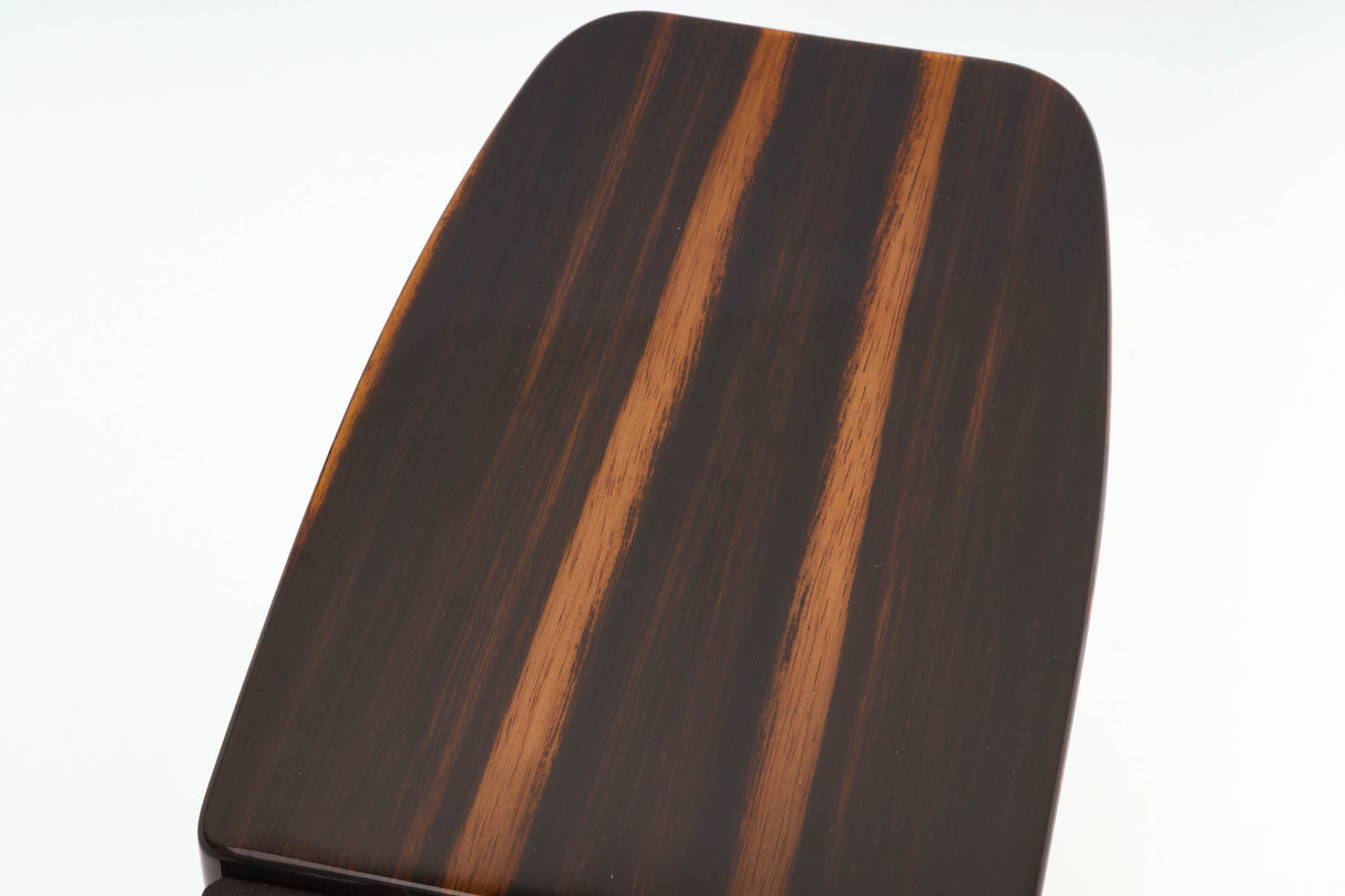 Close up of a used Monitor Audio Gold 50 Standmount Speakers in a piano ebony finish showing some scratches on top