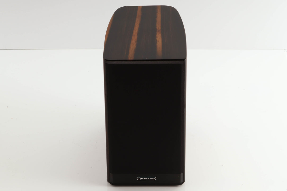 Front view of a used Monitor Audio Gold 50 Standmount Speakers in a piano ebony finish showing Grille