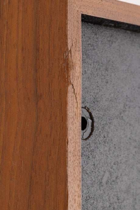 Close up of a used Monitor Audio MA5 Series II Standmount Speakers in a Teak finish showing damage on front left corner