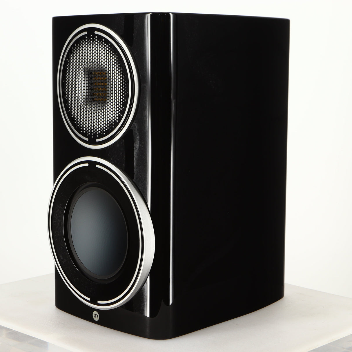 Front right corner of a used Monitor Audio Platinum PL100 III Standmount Speaker in a piano black finish