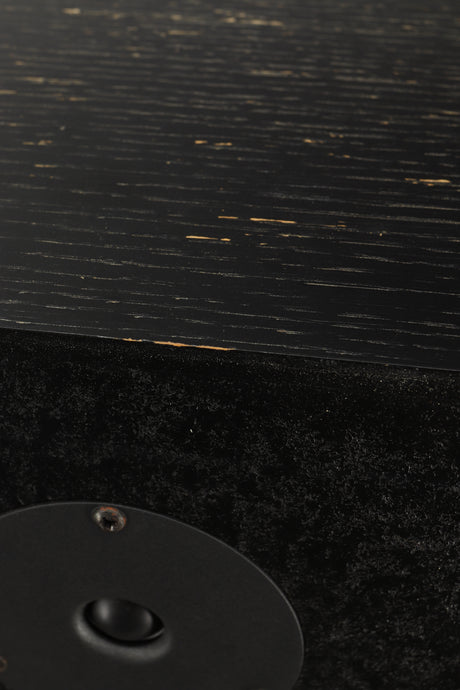 Close up view of a used Monitor Audio R352 Standmount Speakers in Black Ash finish showing chips to the paint work 