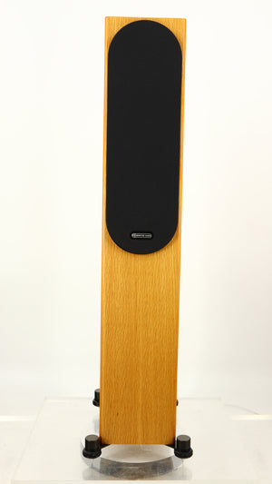 Front view of a used Monitor Audio Silver 200 6G Floorstanding Speakers in an oak finish showing Grille