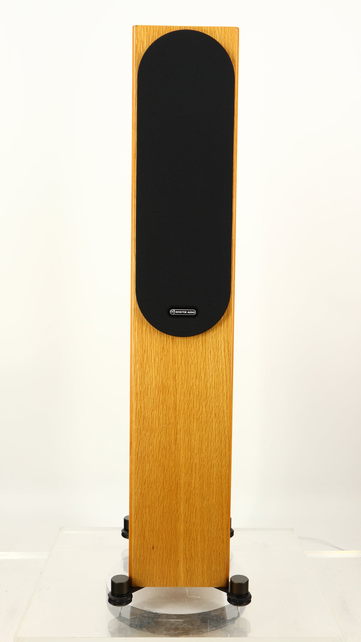 Front view of a used Monitor Audio Silver 200 6G Floorstanding Speakers in an oak finish showing Grille