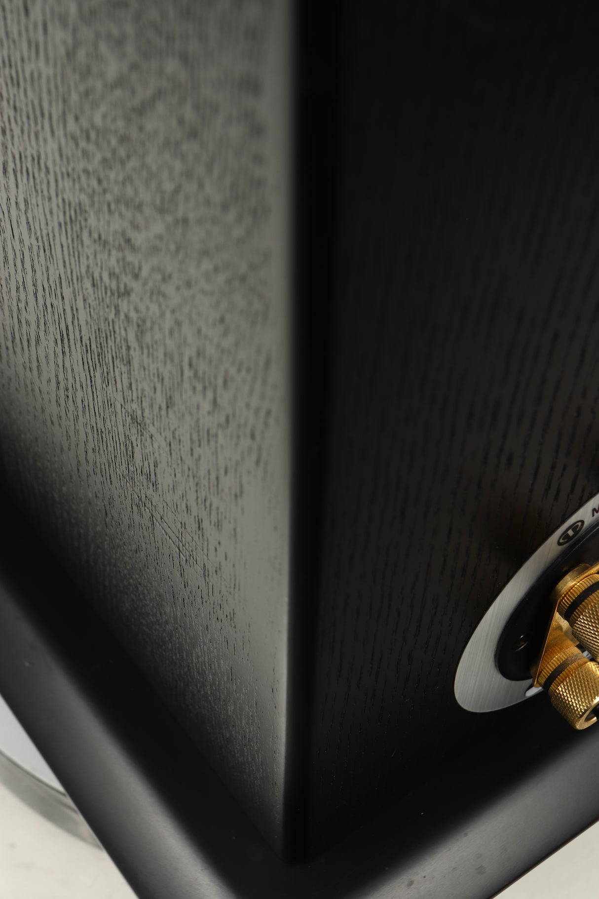 Close up of a used Monitor Audio Silver 8 Floorstanding Speaker in a black oak finish showing scratching on right side