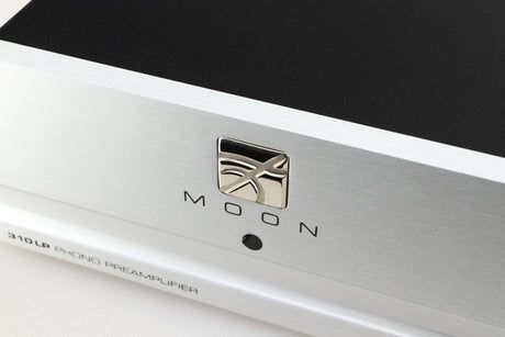 Close up of a used Moon 310LP Phonostage in a silver finish showing the logo