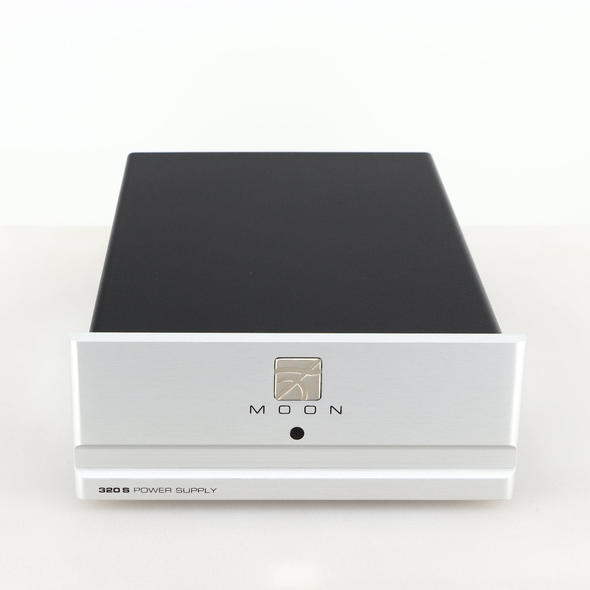 Front view of a used Moon 320S Power Supply in a silver finish