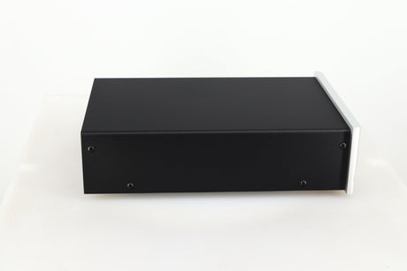 Left side view of a used Moon 320S Power Supply in a silver finish