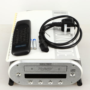 Top of a used Musical Fidelity X-Ray 24 Bit CD Player showing Remote, 2x Batteries, Mains Cable and Manual