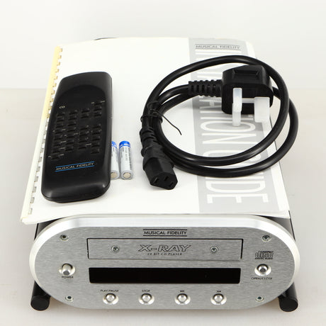 Top of a used Musical Fidelity X-Ray 24 Bit CD Player showing Remote, 2x Batteries, Mains Cable and Manual