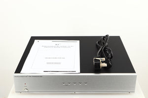 Top of a used Musical Fidelity A3 24 192 Upsampling DAC showing Manual and Mains Cable