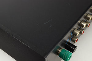 Close up view of a used Musical Fidelity B1 Integrated Amplifier showing scratching