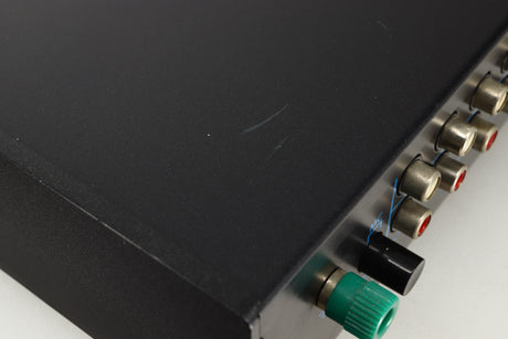 Close up view of a used Musical Fidelity B1 Integrated Amplifier showing scratching