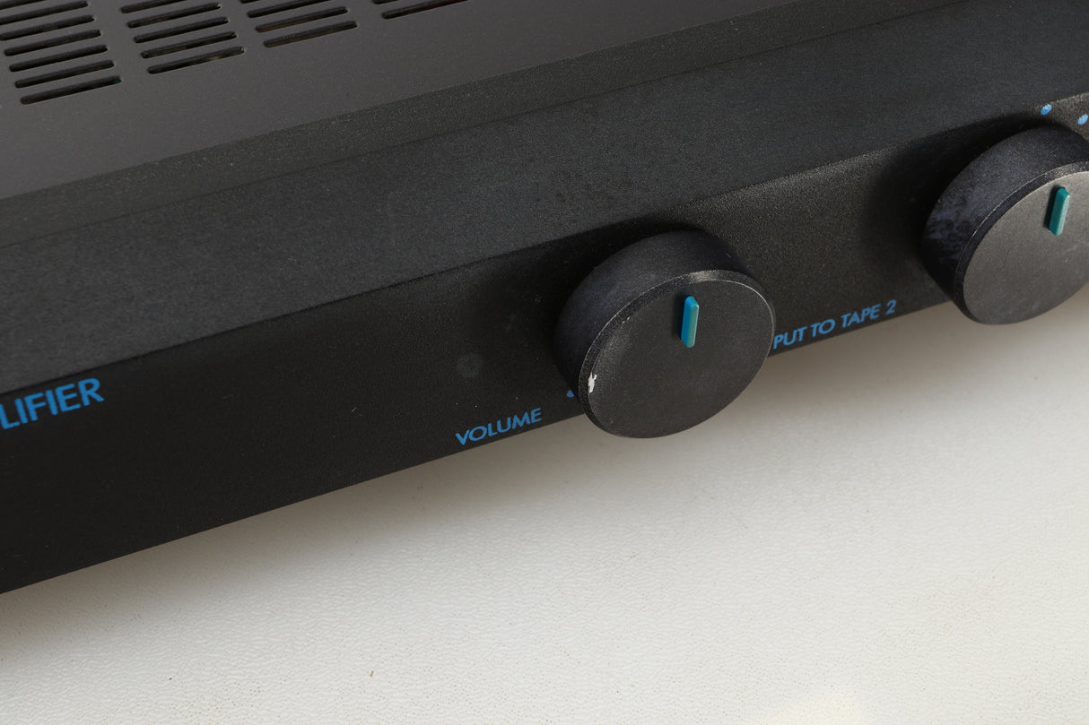 Close up view of a used Musical Fidelity B1 Integrated Amplifier showing discolouration and paint chipping 