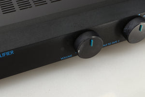 Close up view of a used Musical Fidelity B1 Integrated Amplifier showing discolouration and paint chipping 