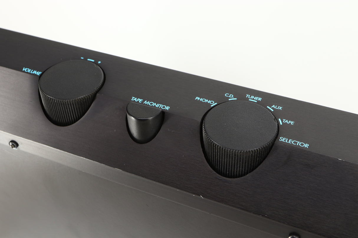 Close up of a used Musical Fidelity B200 Integrated Amplifier in a black finish showing scratching on fascia