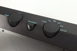 Close up of a used Musical Fidelity B200 Integrated Amplifier in a black finish showing scratching on fascia