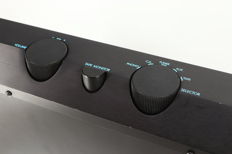 Close up of a used Musical Fidelity B200 Integrated Amplifier in a black finish showing scratching on fascia