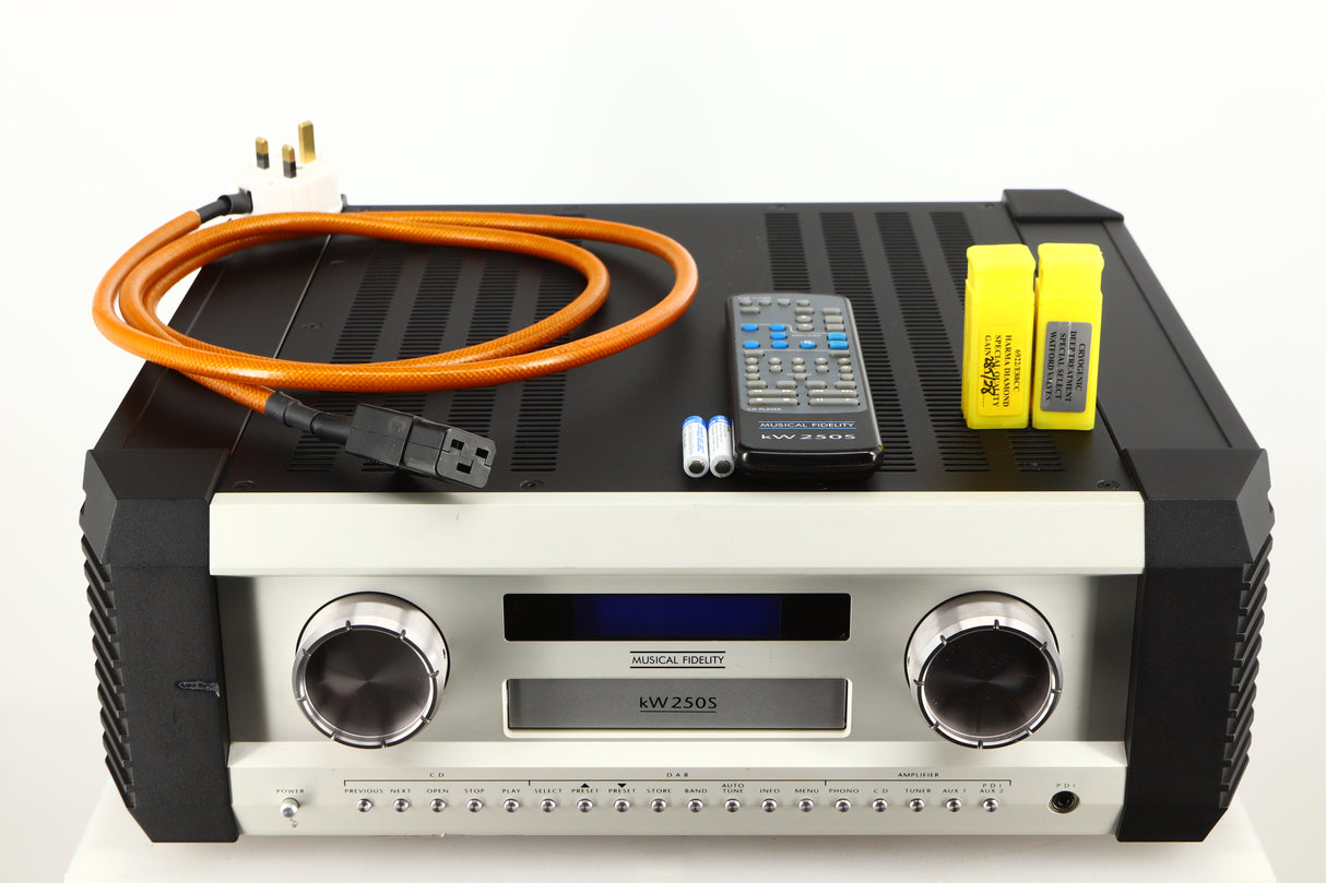 Top of a used Musical Fidelity KW250S Integrated System showing Power Cable, Remote and 2x Batteries