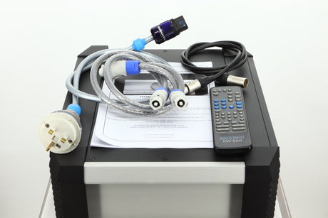 View of a used Musical Fidelity KW550 Integrated Amplifiers accessories showing mains cable, remote, and PSU cables