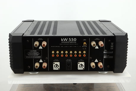 Rear view of a used Musical Fidelity KW550 Integrated Amplifier showing speaker outputs, PSU inputs, and RCA outputs