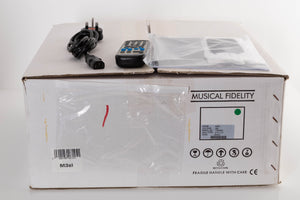 Box of a used Musical Fidelity M3si Integrated Amplifier in Black with mains cable, manual, and remote