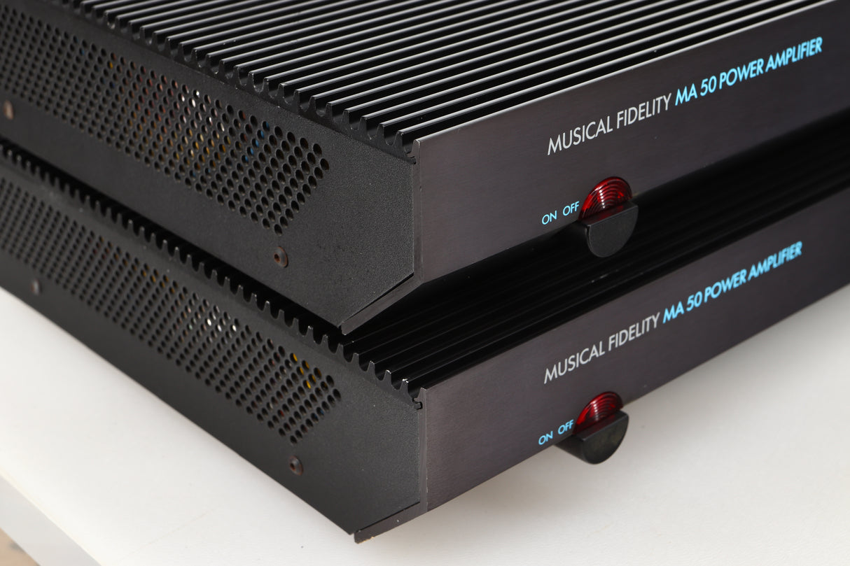 Front left corner view of a pair of used Musical Fidelity MA50 Class A Monoblock Power Amplifiers in Black finish