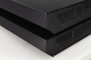 Front right corner view of a pair of used Musical Fidelity MA50 Class A Monoblock Power Amplifiers in Black finish